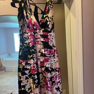 This is a vintage dress. No tags. Fitted halter with open back.